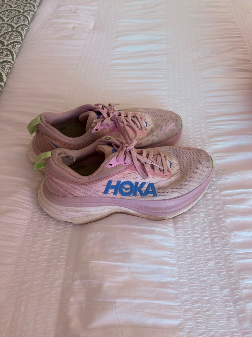 Hoka Pink Running Shoes with Blue Logo and Green Heel Tabs